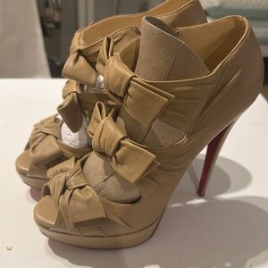 Louboutin Madame Butterfly Booties, featuring a peep-toe design and stacked bow